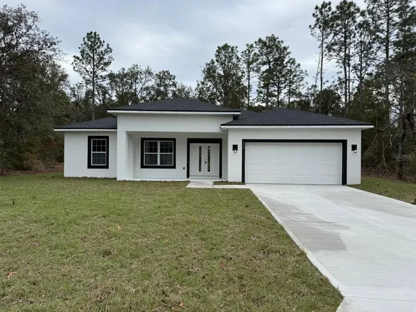 front view of a house with a yard