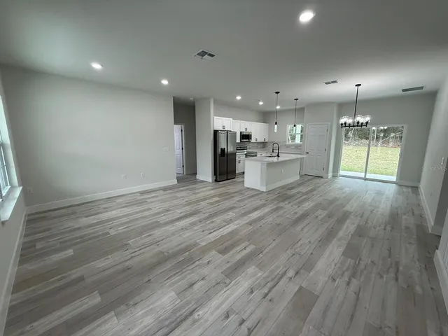 a view of kitchen and windows