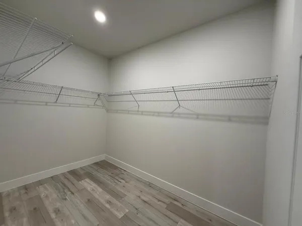 a view of a room with racks on the wall
