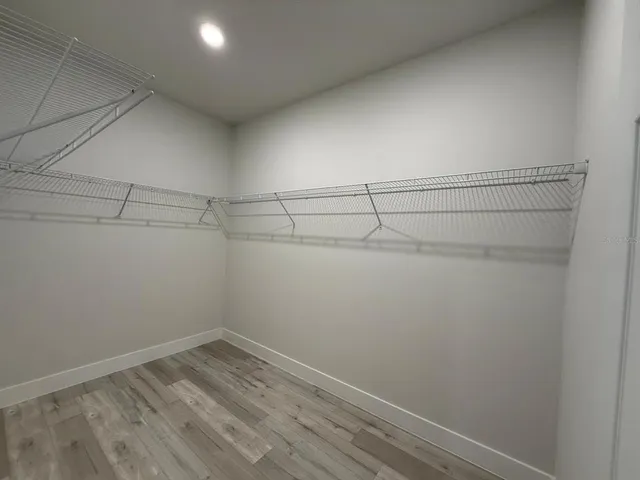 a view of a room with racks on the wall