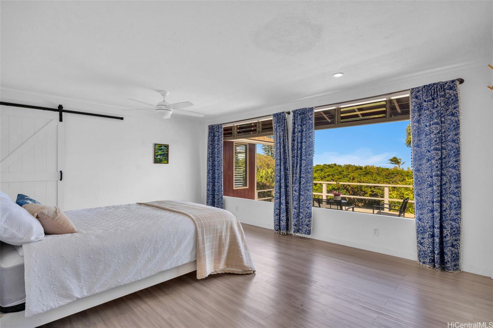 2576 Alohia Place Haiku, HI 96708 - Photo 14 of 25 a bedroom with a bed and a large window