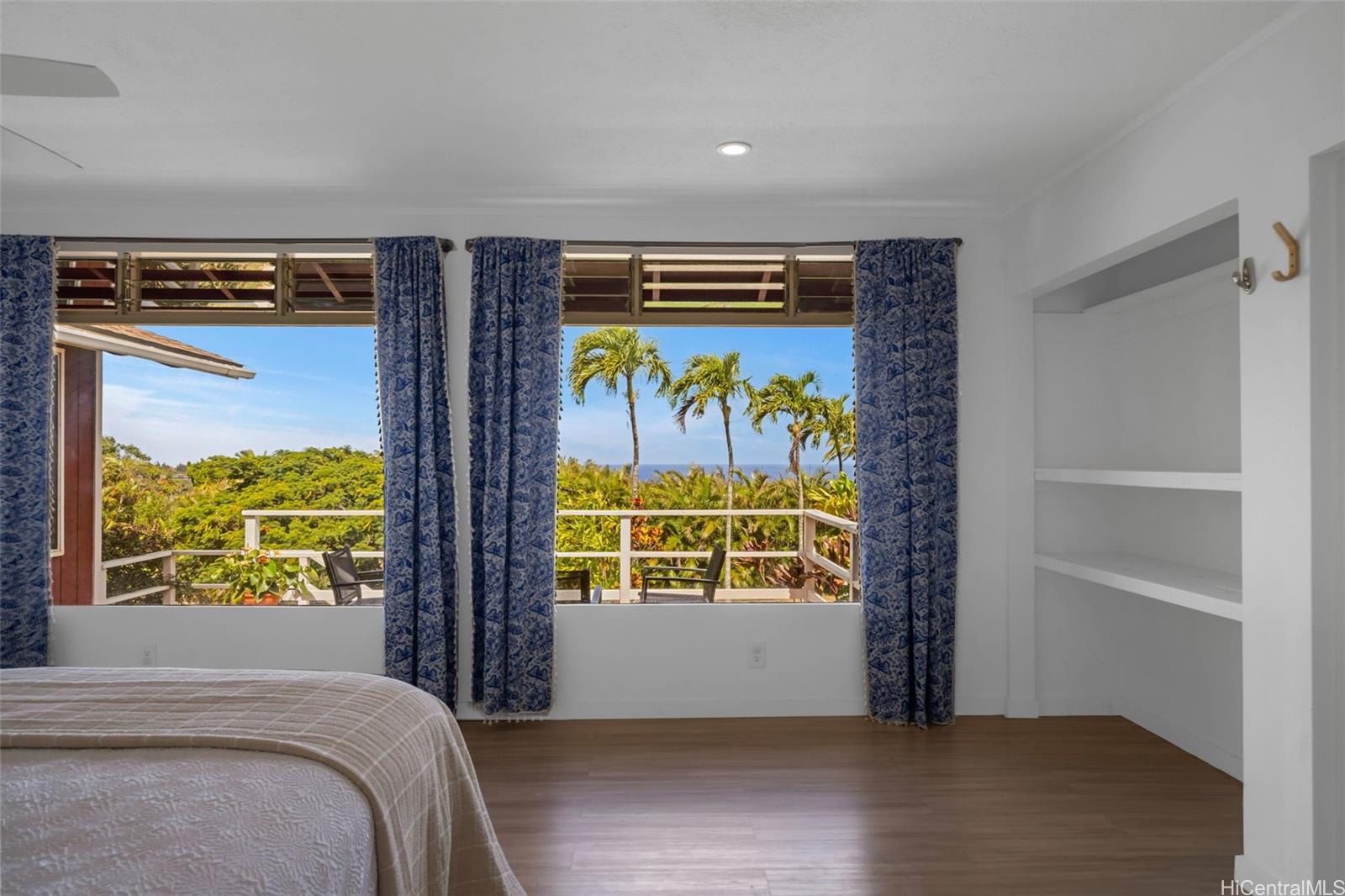 2576 Alohia Place Haiku, HI 96708 - Photo 16 of 25 a view of a hallway with wooden floor and windows