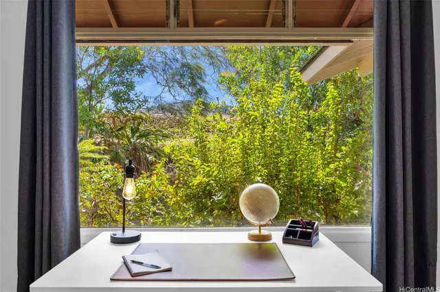 a view of dining room and floor to ceiling window with wooden floor