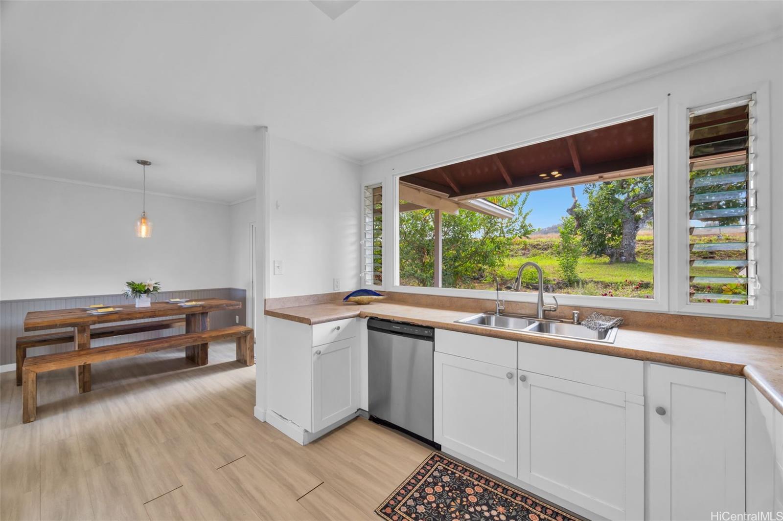 2576 Alohia Place Haiku, HI 96708 - Photo 9 of 25 a kitchen with a sink and large window