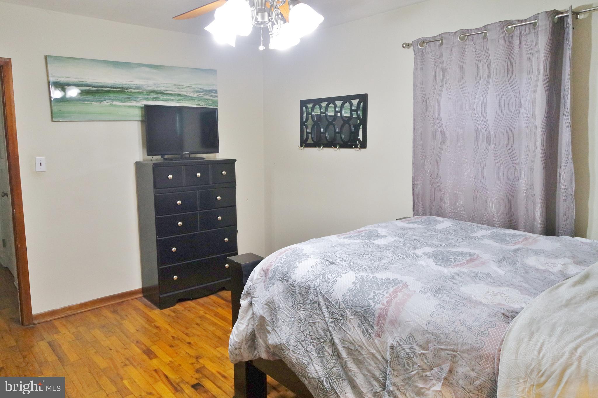 293 Valley Mill Road Winchester, VA 22602 - Photo 15 of 29 a bedroom with a bed and a chandelier