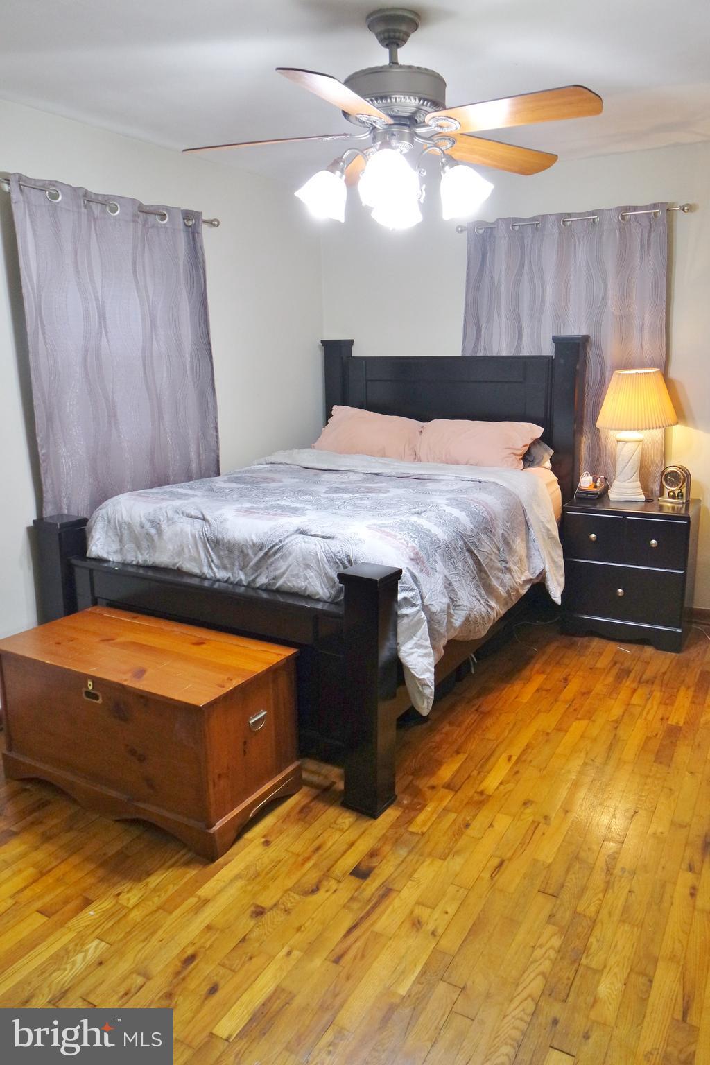 293 Valley Mill Road Winchester, VA 22602 - Photo 16 of 29 a bedroom with a bed and a chandelier