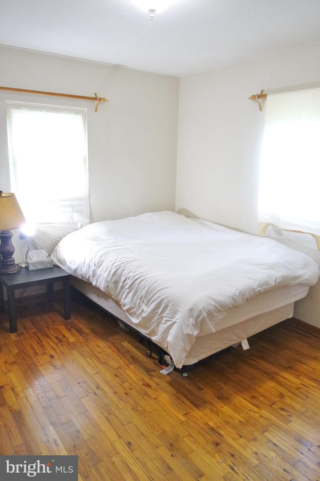293 Valley Mill Road Winchester, VA 22602 - Photo 17 of 29 a bedroom with a bed and wooden floor