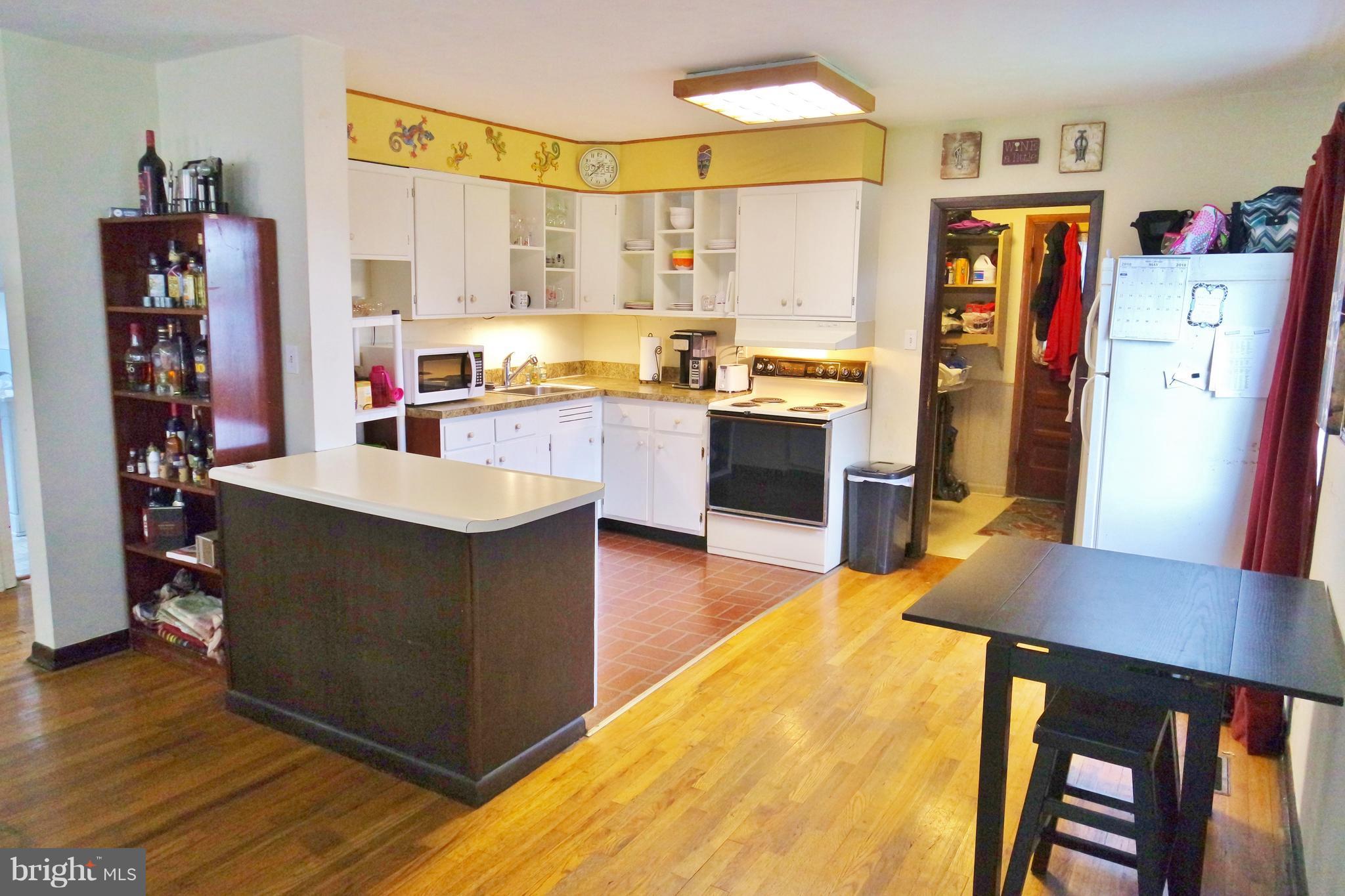293 Valley Mill Road Winchester, VA 22602 - Photo 7 of 29 a kitchen with stainless steel appliances granite countertop a refrigerator and a stove top oven