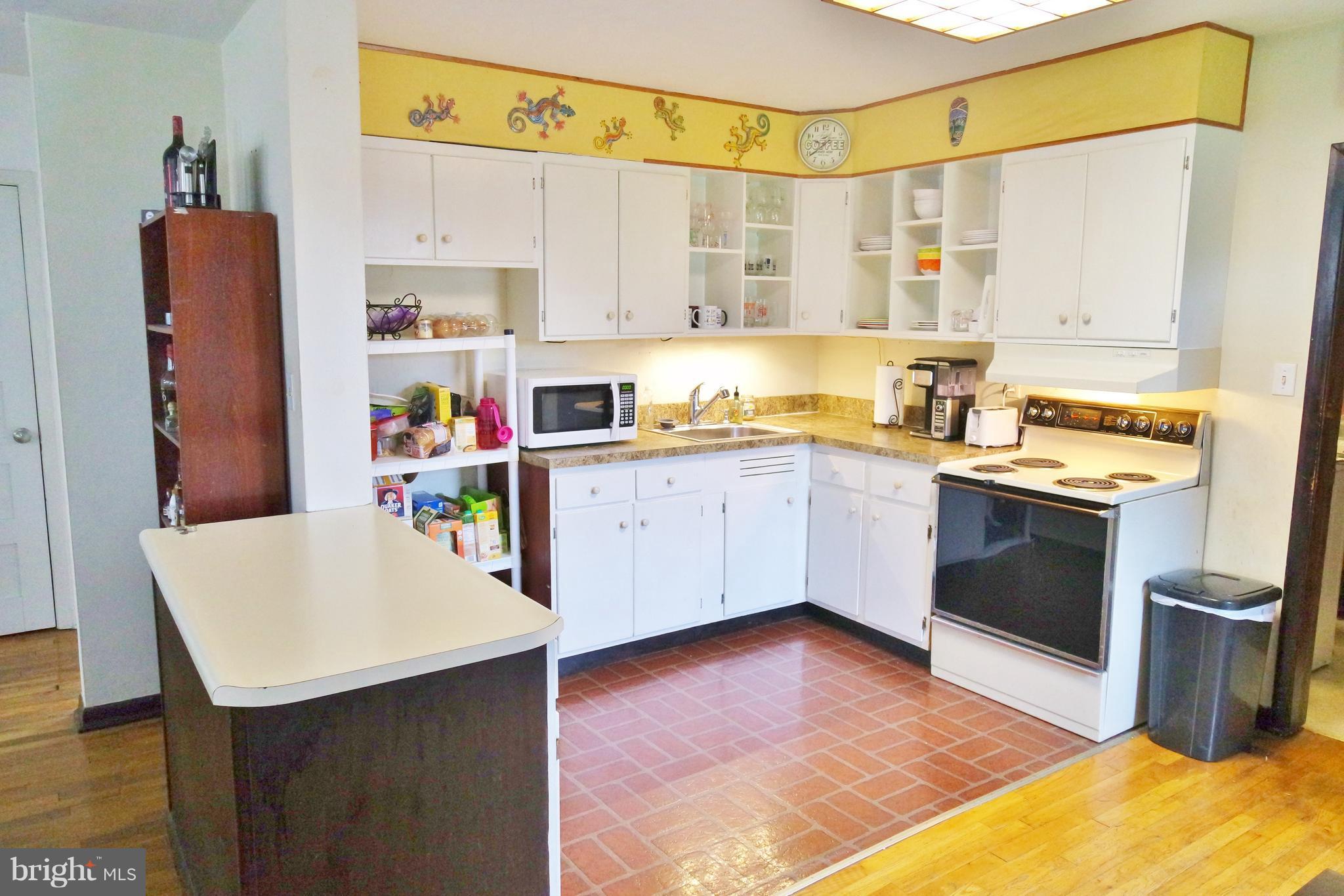 293 Valley Mill Road Winchester, VA 22602 - Photo 8 of 29 a kitchen with stainless steel appliances a sink cabinets and wooden floor