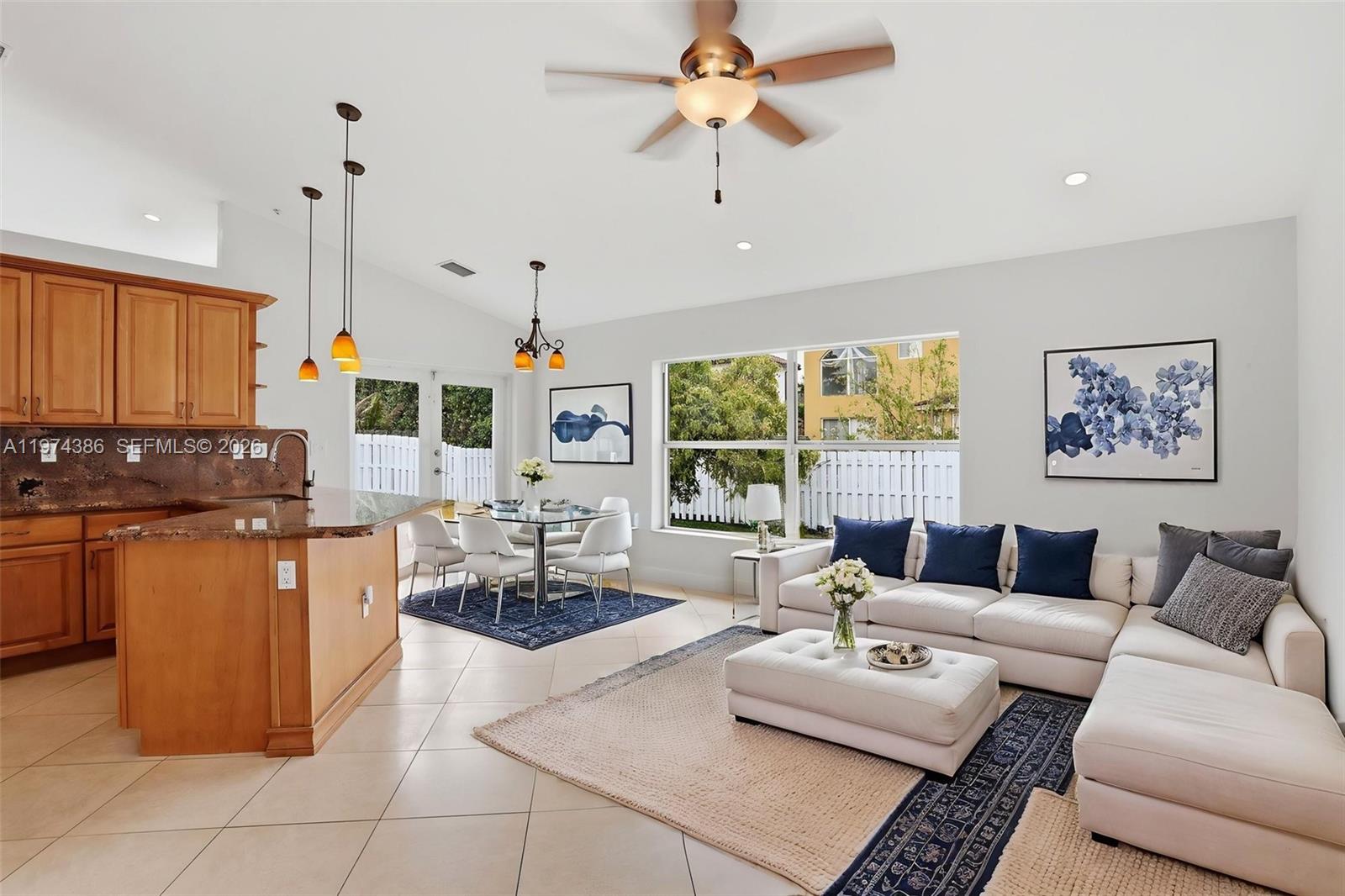 12930 Southwest 20th Street Miramar, FL 33027 - Photo 15 of 48 a living room with furniture and a large window
