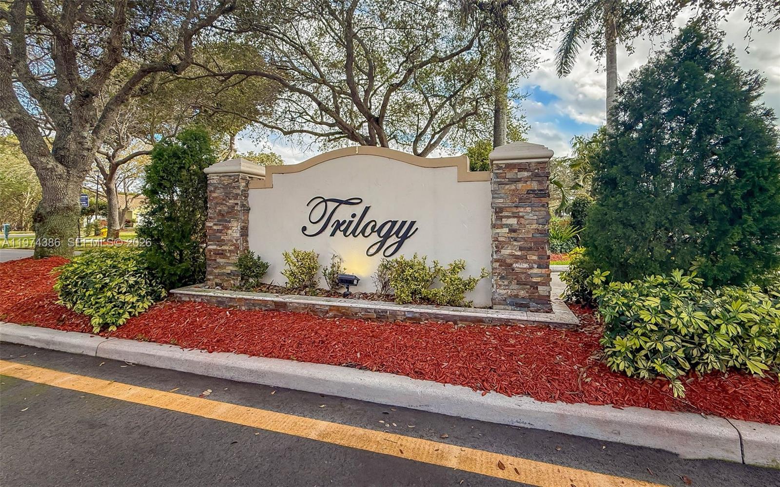 12930 Southwest 20th Street Miramar, FL 33027 - Photo 2 of 48 a sign that is on the side of a road