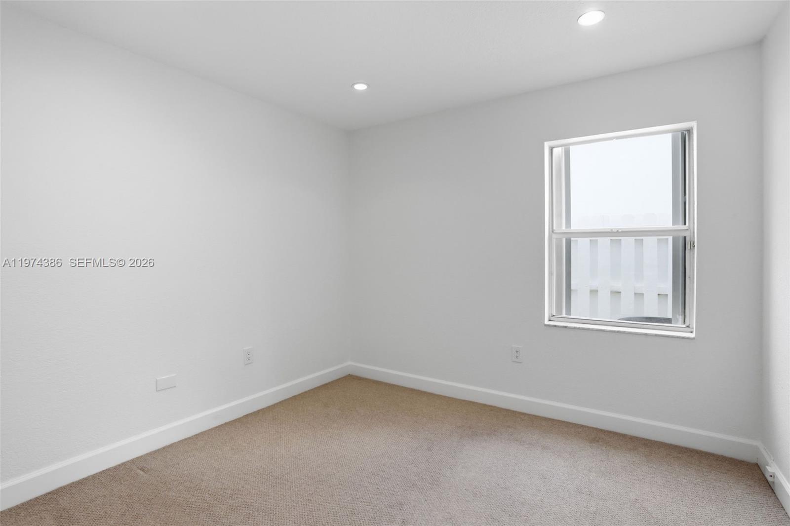 12930 Southwest 20th Street Miramar, FL 33027 - Photo 24 of 48 an empty room with a window