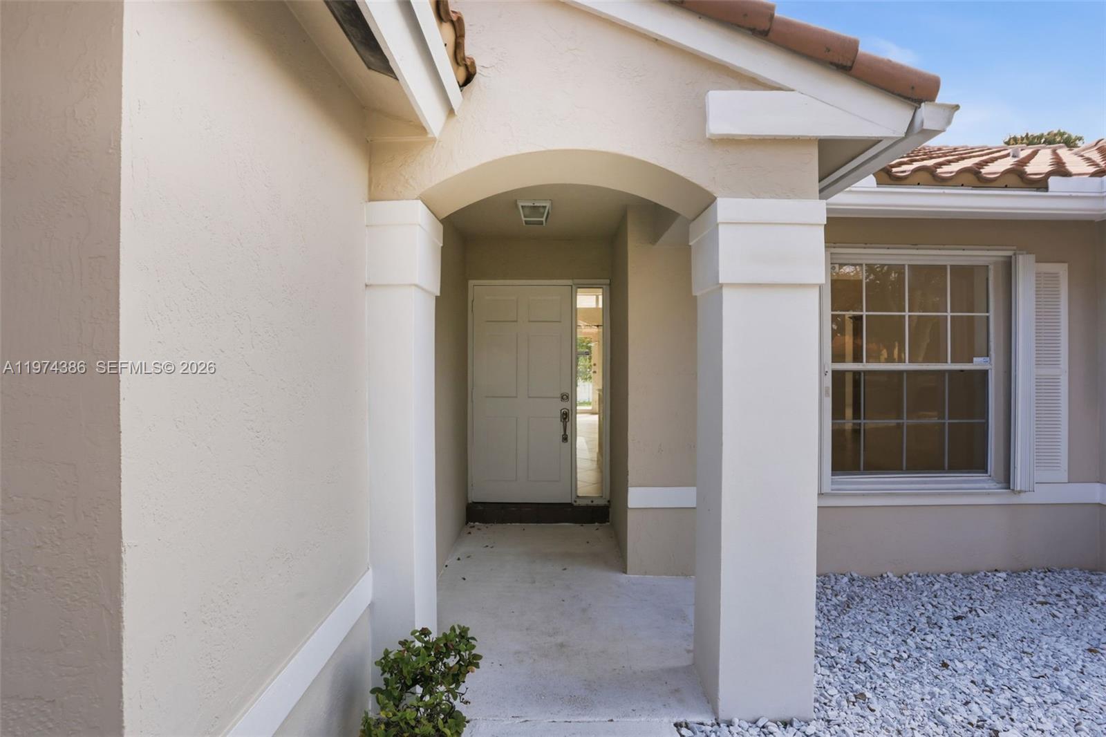 12930 Southwest 20th Street Miramar, FL 33027 - Photo 3 of 48 a view of a entryway door front of house