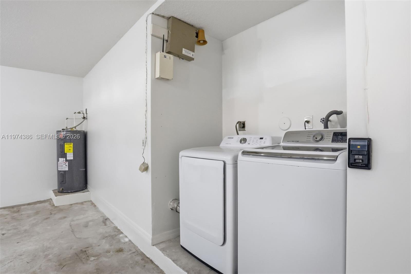 12930 Southwest 20th Street Miramar, FL 33027 - Photo 32 of 48 a utility room with dryer and washer