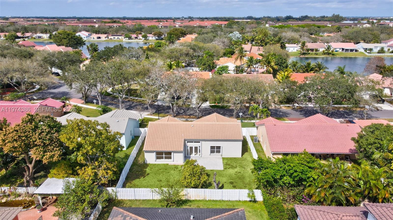 12930 Southwest 20th Street Miramar, FL 33027 - Photo 37 of 48 an aerial view of residential houses with outdoor space