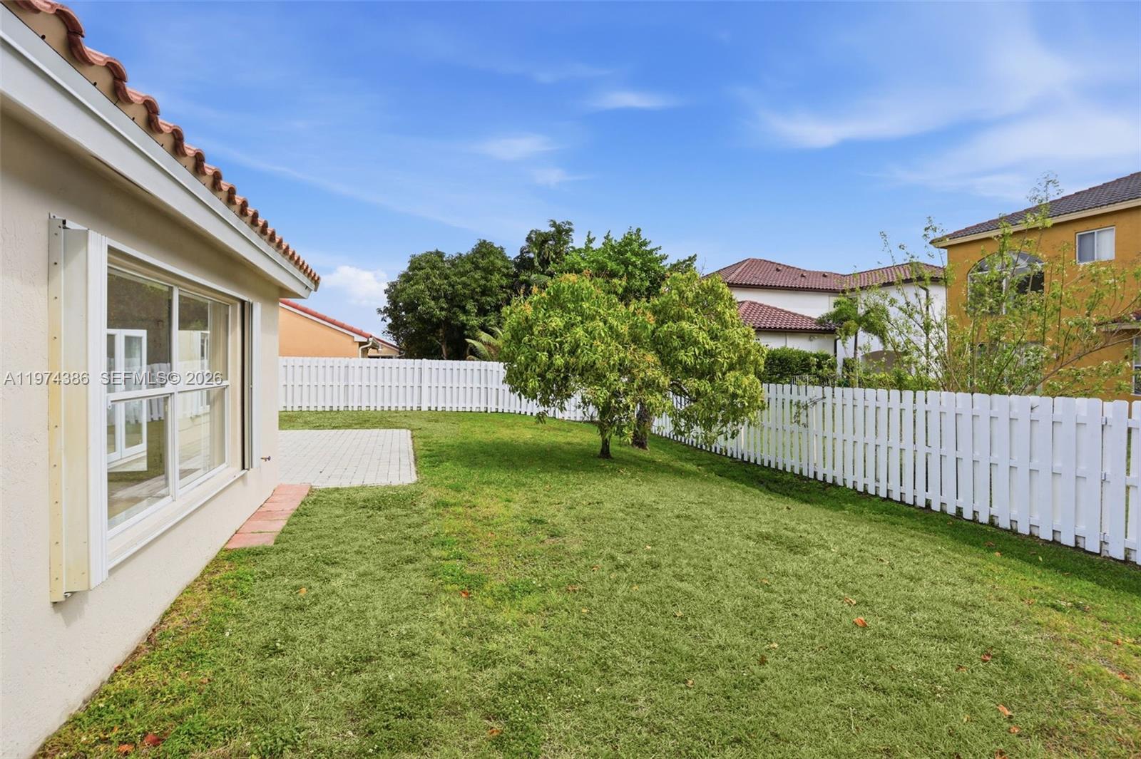 12930 Southwest 20th Street Miramar, FL 33027 - Photo 38 of 48 a view of a backyard with a garden
