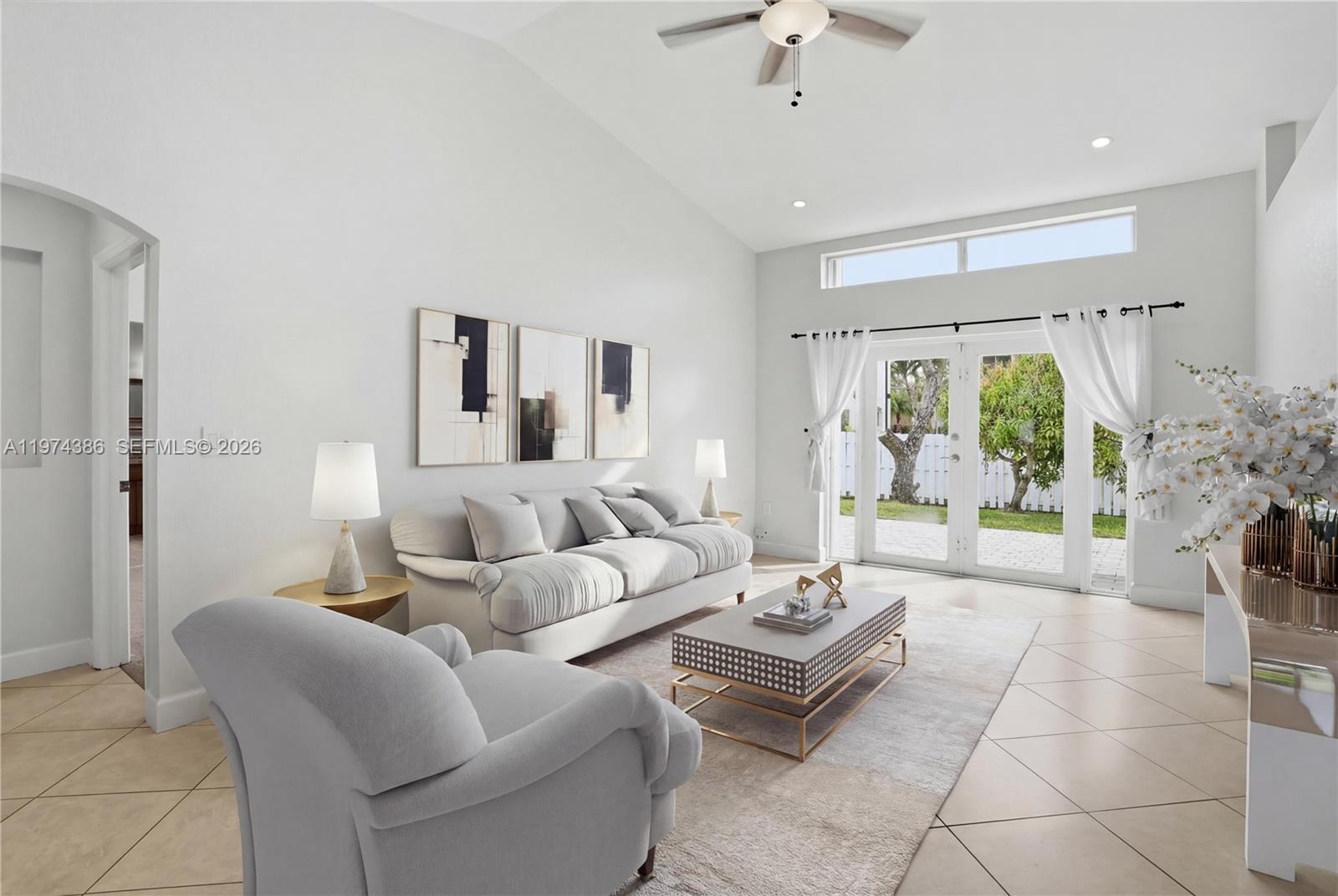 12930 Southwest 20th Street Miramar, FL 33027 - Photo 4 of 48 a living room with furniture and a large window