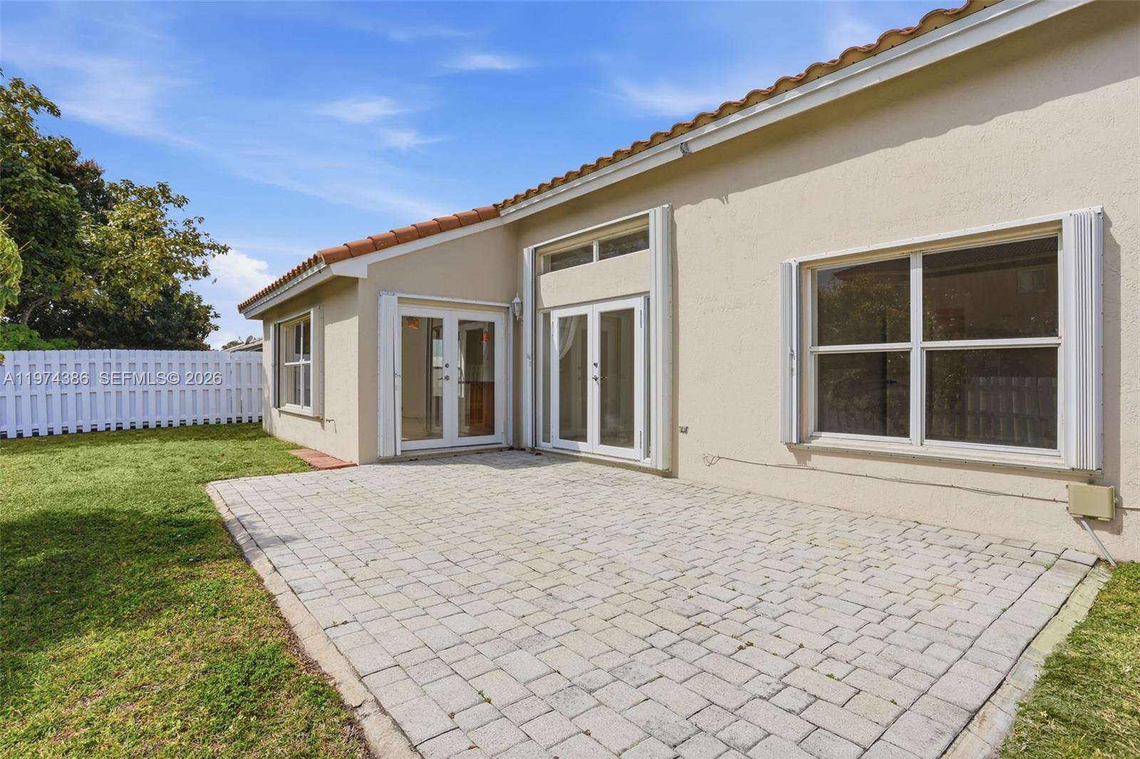 12930 Southwest 20th Street Miramar, FL 33027 - Photo 41 of 48 front view of house with a yard