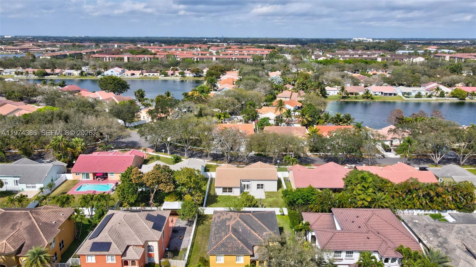 12930 Southwest 20th Street Miramar, FL 33027 - Photo 44 of 48 an aerial view of residential houses with outdoor space