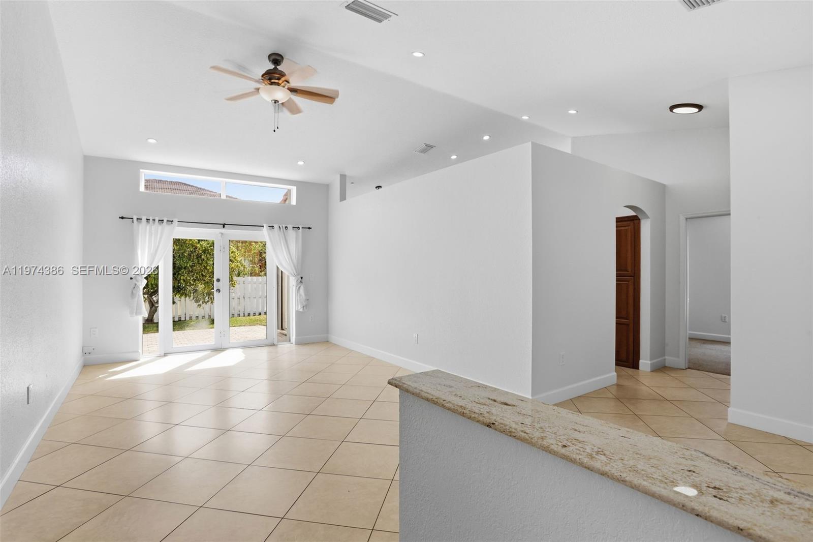 12930 Southwest 20th Street Miramar, FL 33027 - Photo 5 of 48 a view of an empty room with a window