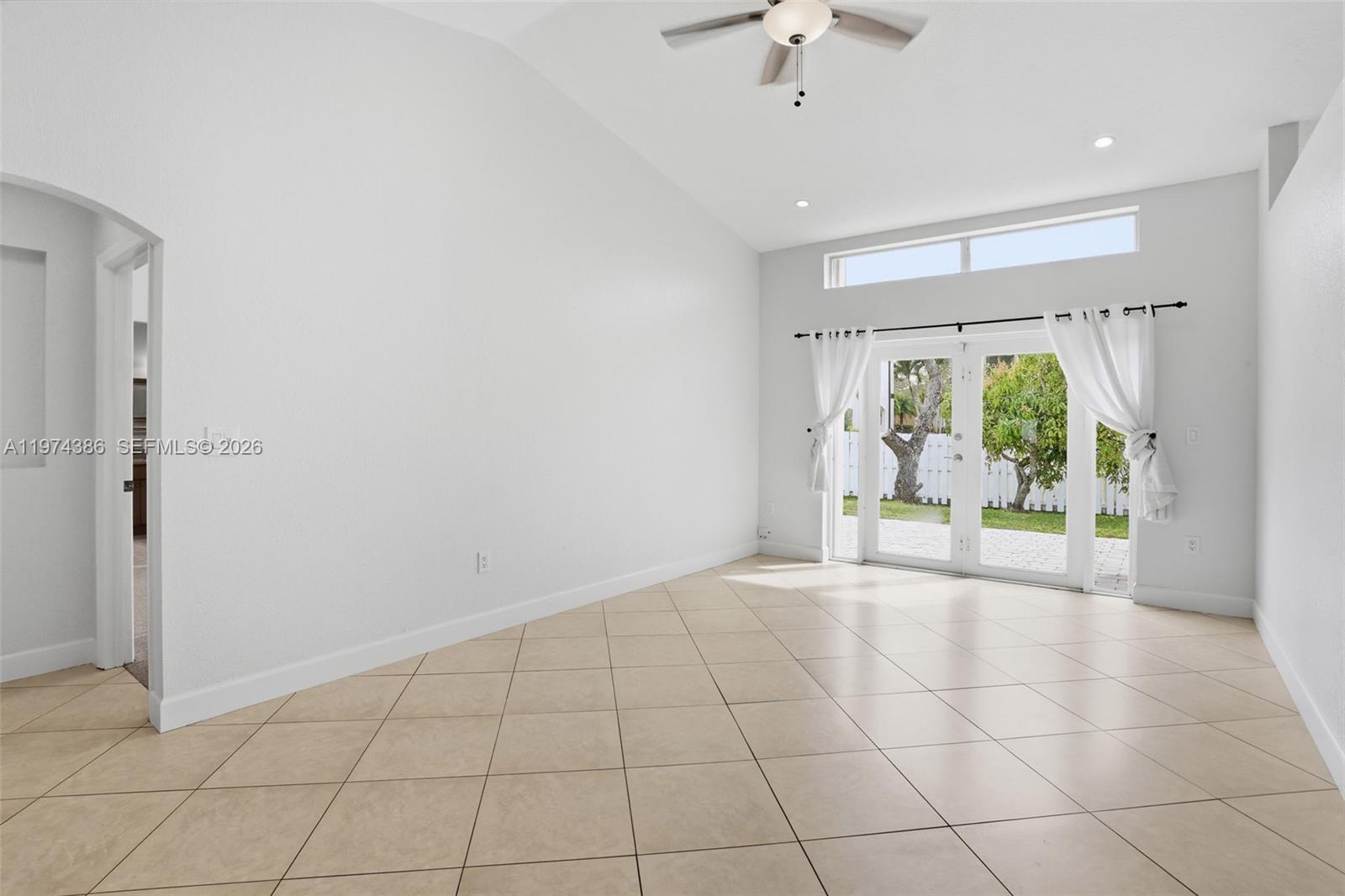 12930 Southwest 20th Street Miramar, FL 33027 - Photo 6 of 48 a view of an empty room with a window