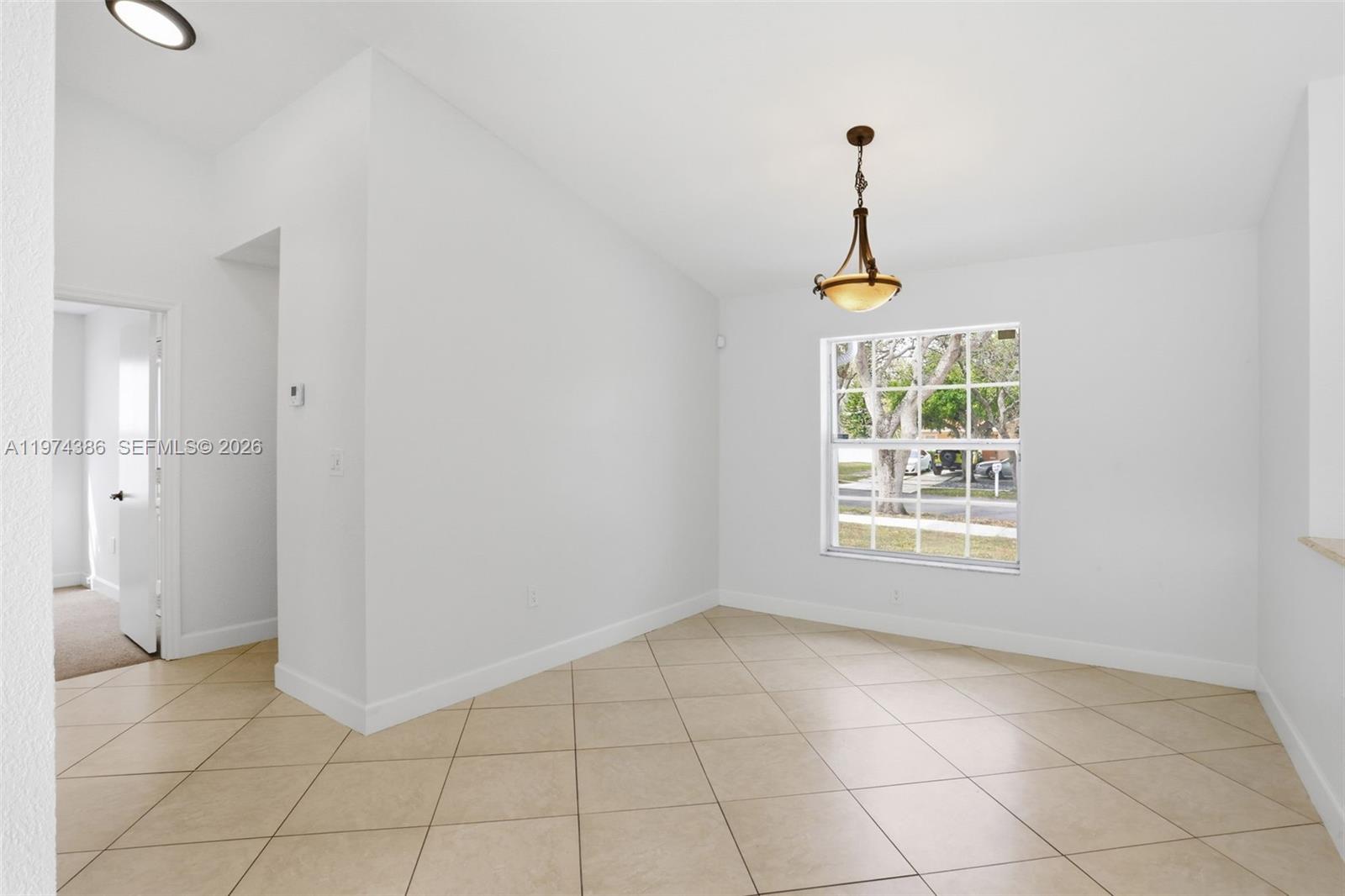 12930 Southwest 20th Street Miramar, FL 33027 - Photo 10 of 48 a view of an empty room with a window