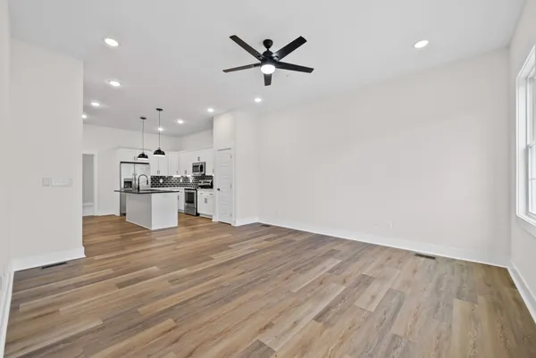 a view of kitchen with wooden floor and window