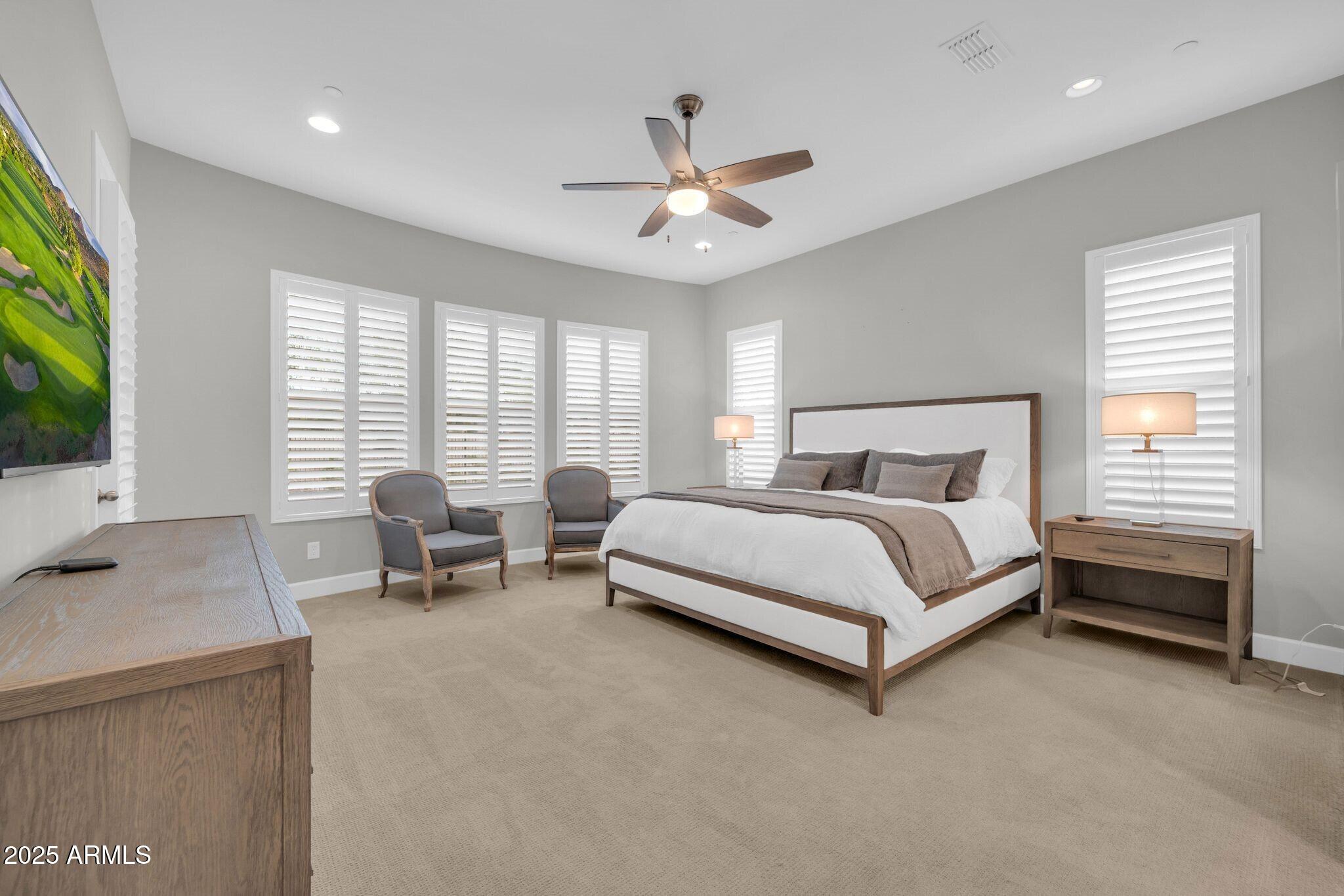17565 Blaze Lane Rio Verde, AZ 85263 - Photo 14 of 43 a bedroom with bed and a flat tv screen on dresser