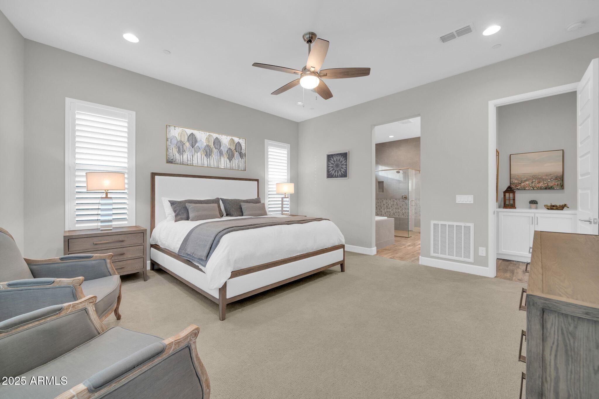 17565 Blaze Lane Rio Verde, AZ 85263 - Photo 15 of 43 a bedroom with a large bed and a couch