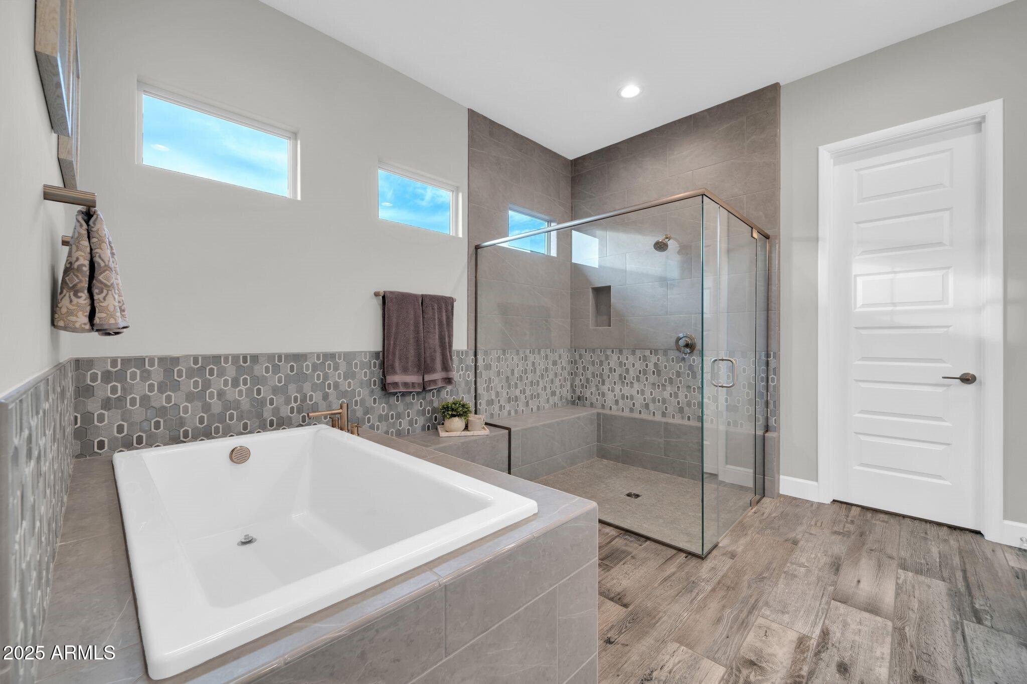 17565 Blaze Lane Rio Verde, AZ 85263 - Photo 16 of 43 a bathroom with a bathtub and a shower