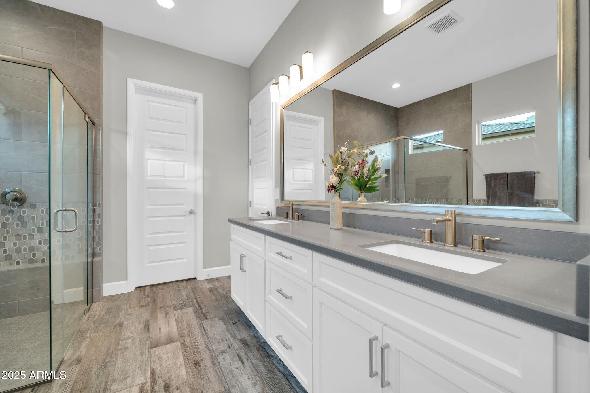17565 Blaze Lane Rio Verde, AZ 85263 - Photo 17 of 43 a bathroom with a double vanity sink and a mirror