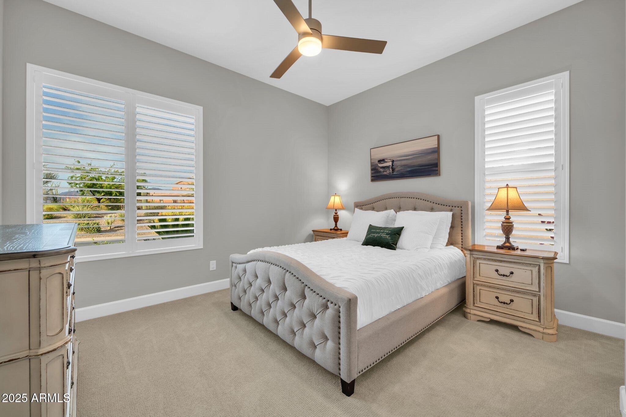 17565 Blaze Lane Rio Verde, AZ 85263 - Photo 18 of 43 a bedroom with a bed table and window