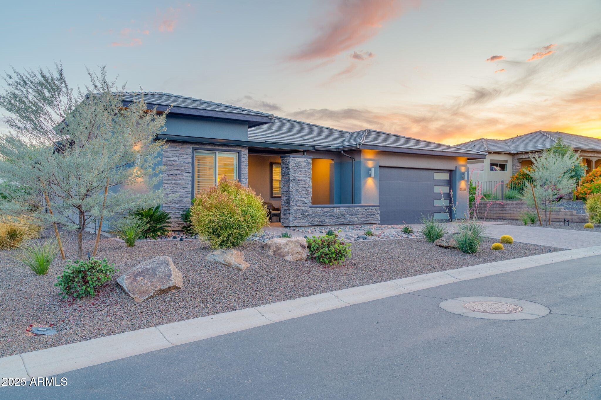 17565 Blaze Lane Rio Verde, AZ 85263 - Photo 2 of 43 a front view of a house with garden