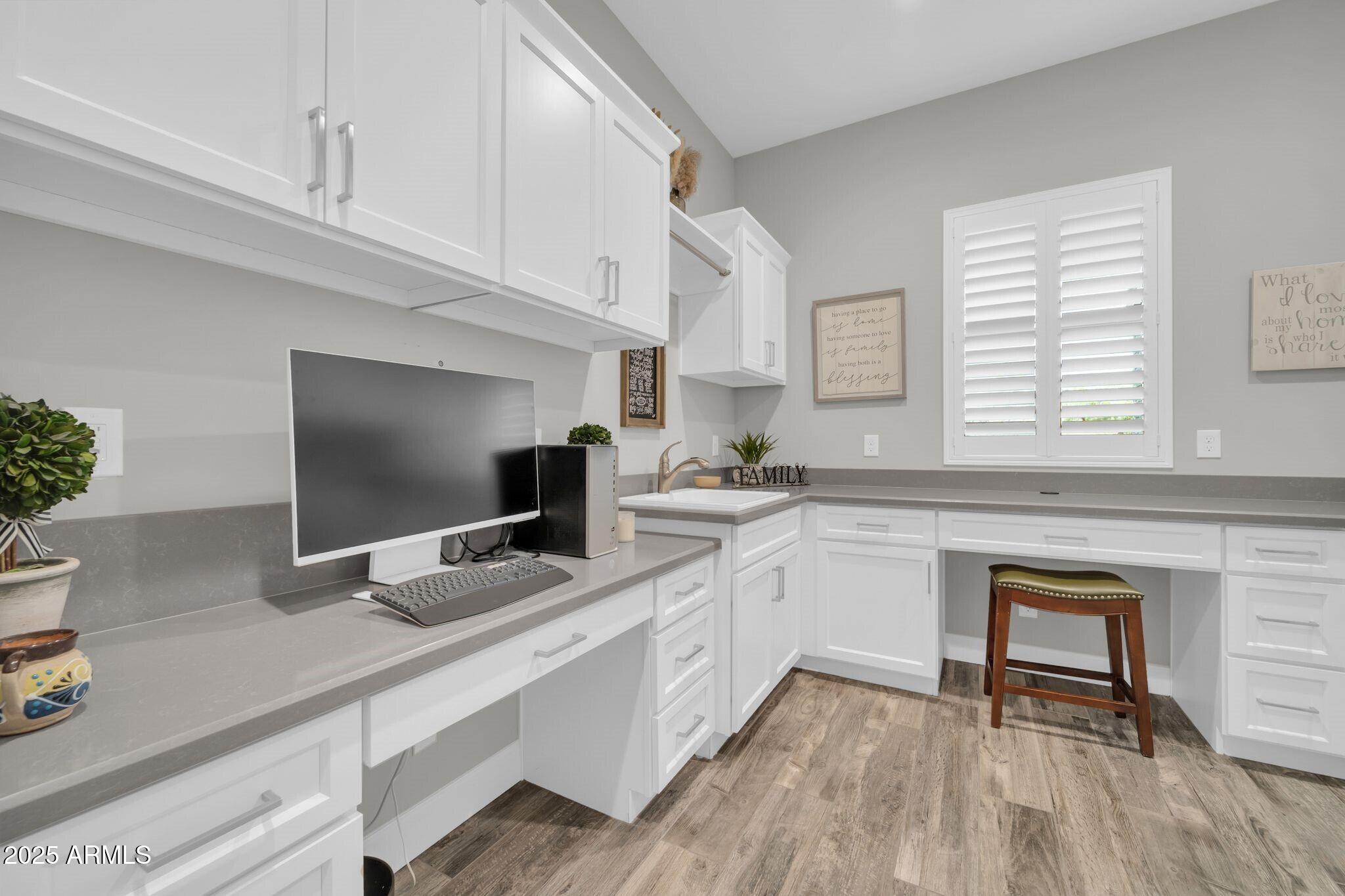 17565 Blaze Lane Rio Verde, AZ 85263 - Photo 22 of 43 a kitchen with white cabinets and appliances