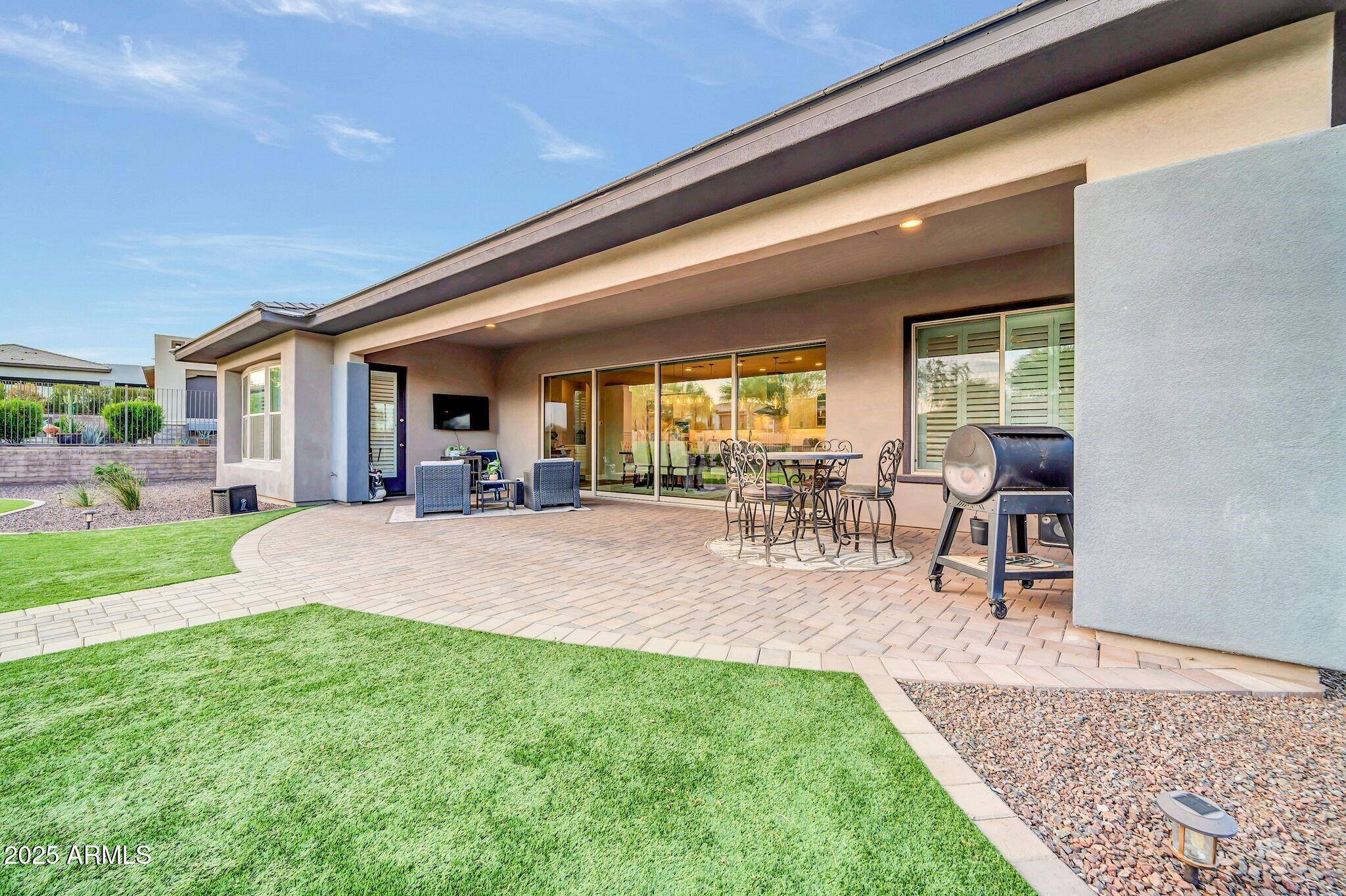 17565 Blaze Lane Rio Verde, AZ 85263 - Photo 25 of 43 a view of a porch with chairs and backyard