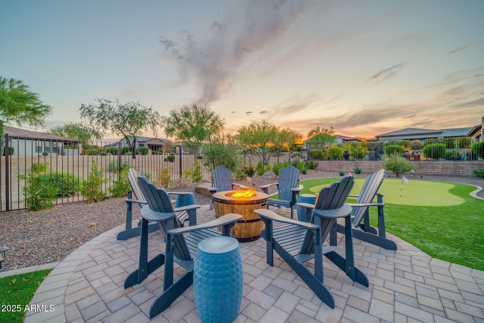 17565 Blaze Lane Rio Verde, AZ 85263 - Photo 29 of 43 a backyard of a house with table and chairs