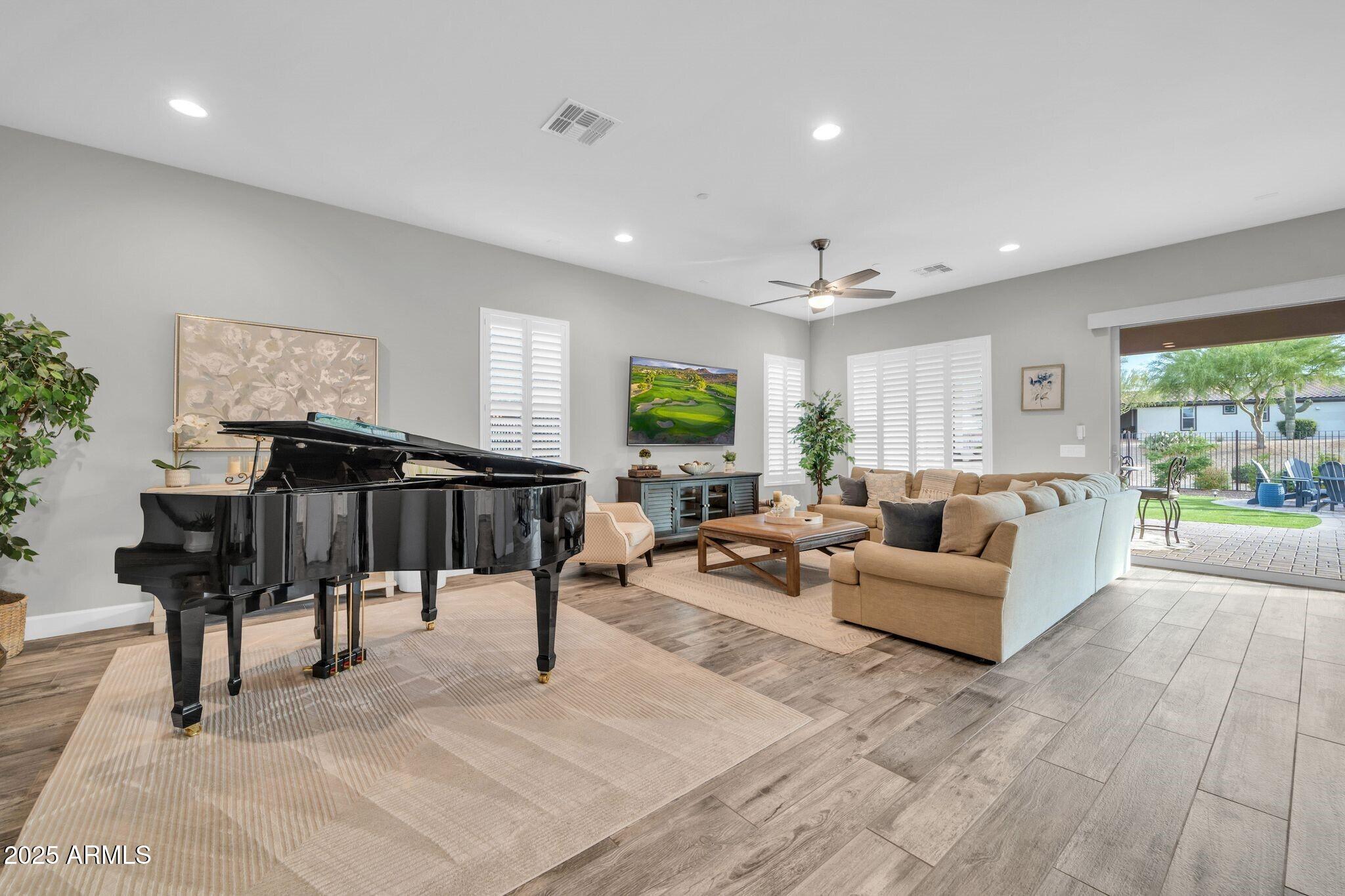 17565 Blaze Lane Rio Verde, AZ 85263 - Photo 5 of 43 a living room with furniture and a large window