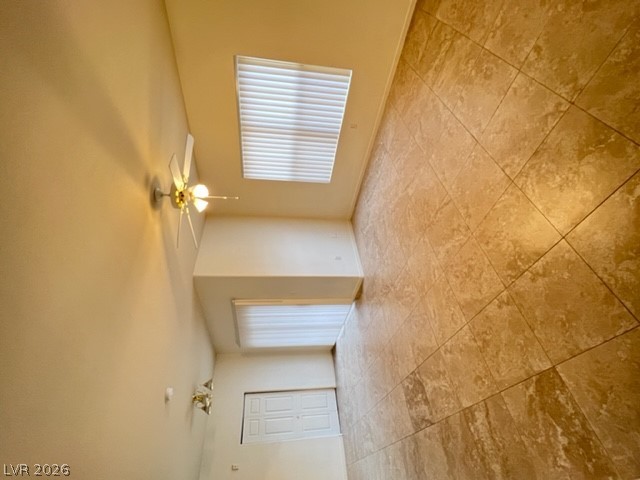 7255 West Sunset Road, Unit 1124 Las Vegas, NV 89113 - Photo 8 of 18 Large tile flooring anchors this versatile space illuminated by clean windows.