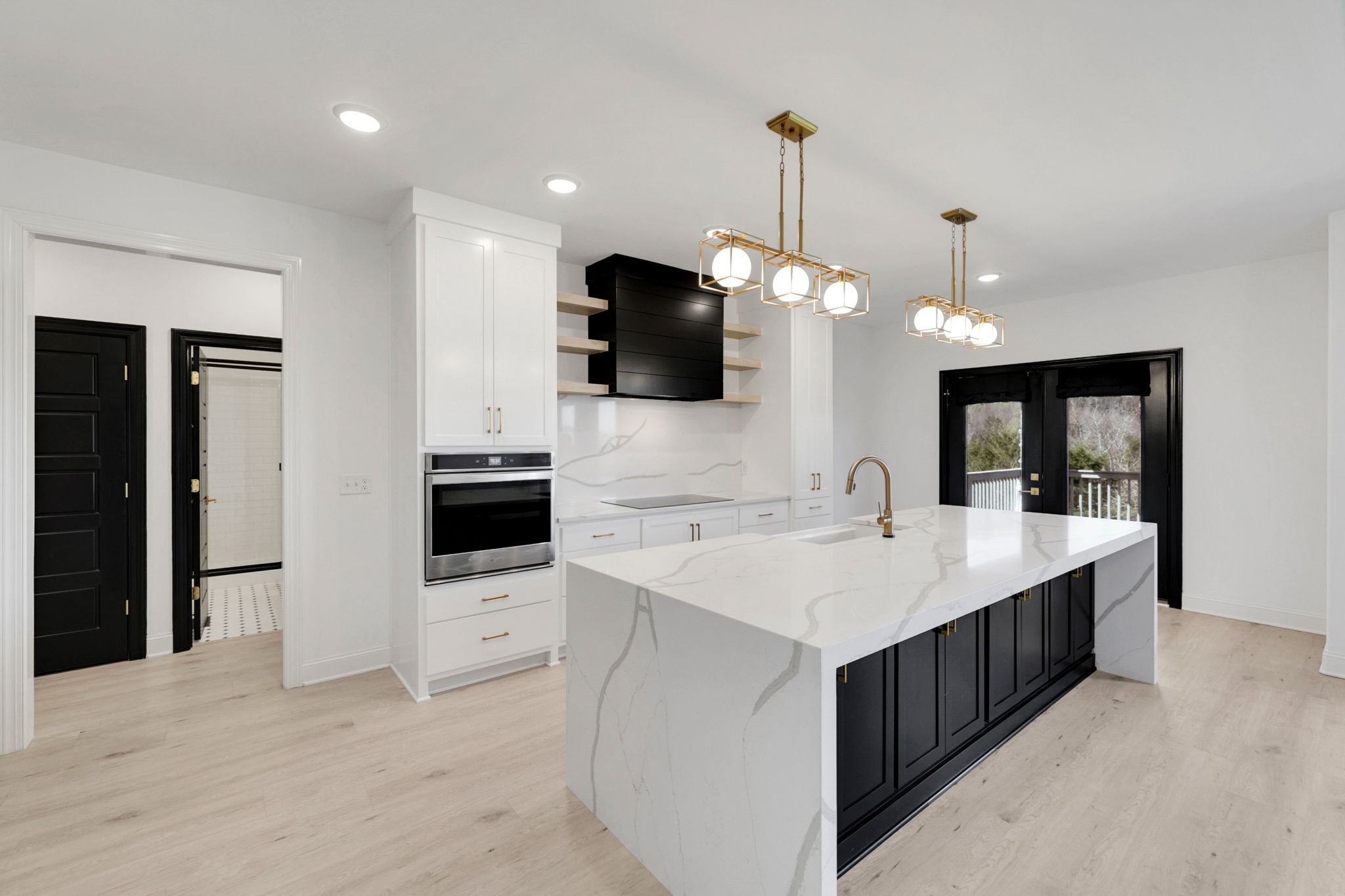 200 Charles Smith Road Lascassas, TN 37085 - Photo 26 of 62 a large kitchen with kitchen island a sink appliances and a counter top space