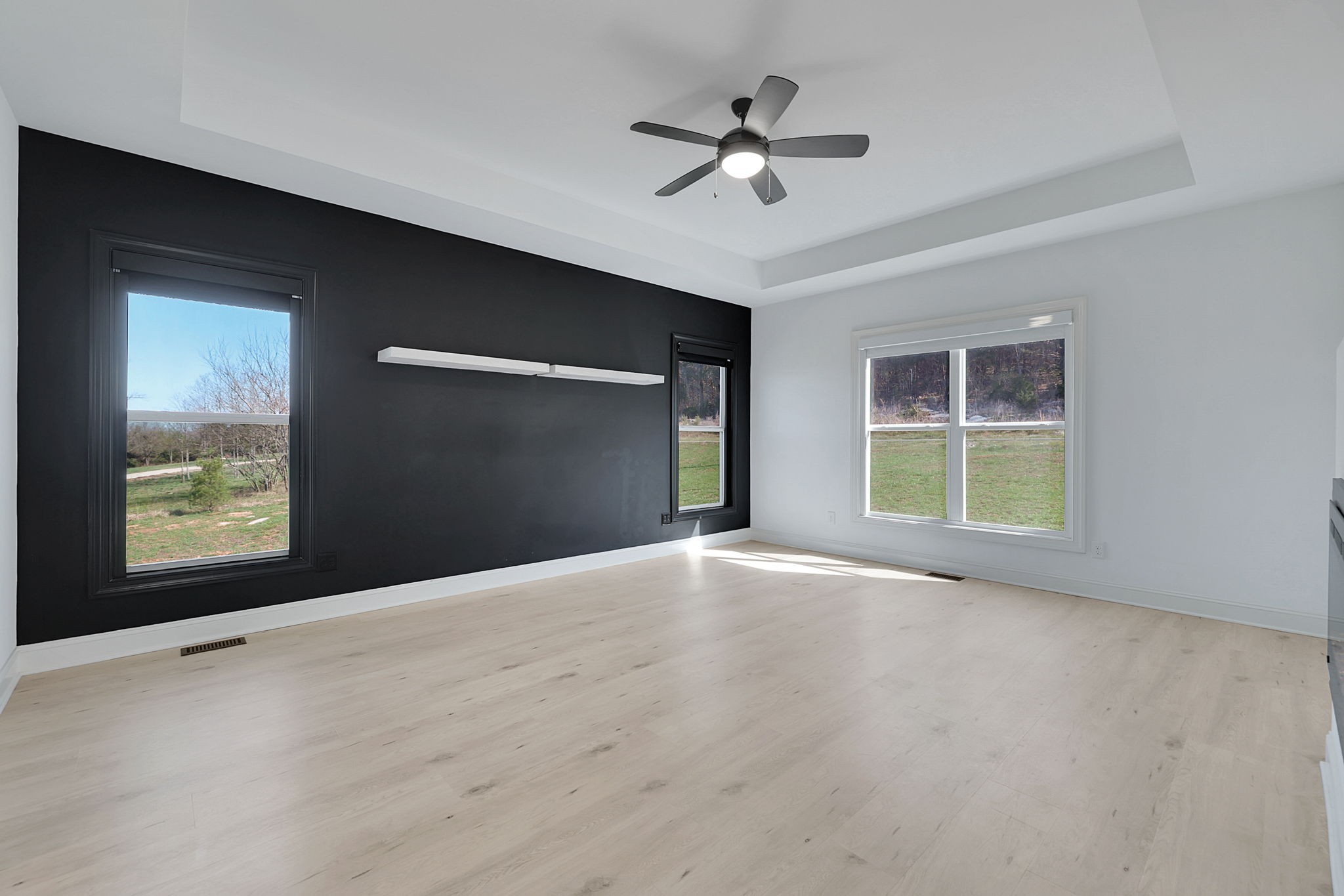 200 Charles Smith Road Lascassas, TN 37085 - Photo 29 of 62 a view of a livingroom with a ceiling fan and window
