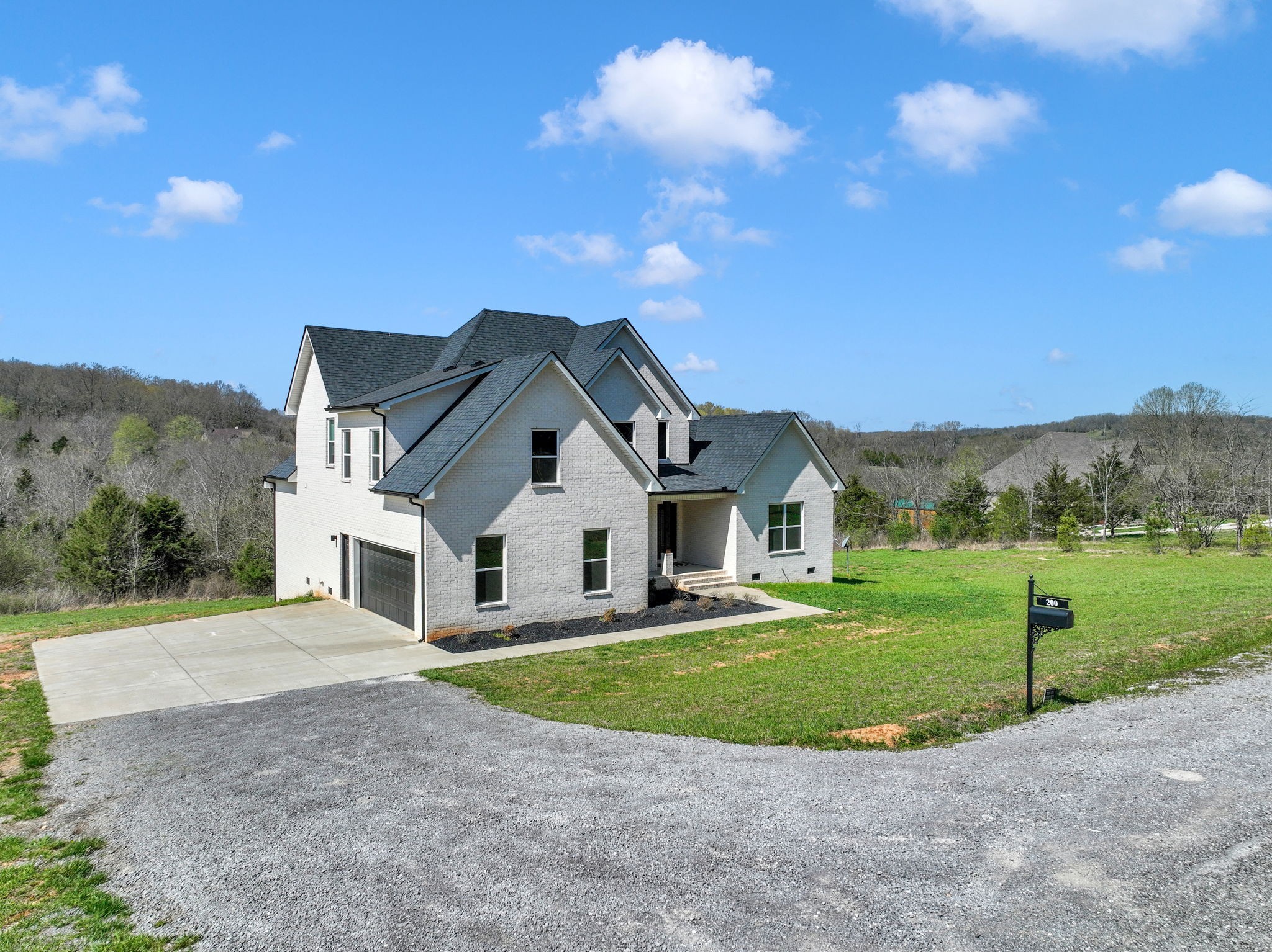 200 Charles Smith Road Lascassas, TN 37085 - Photo 3 of 62 a front view of a house with yard
