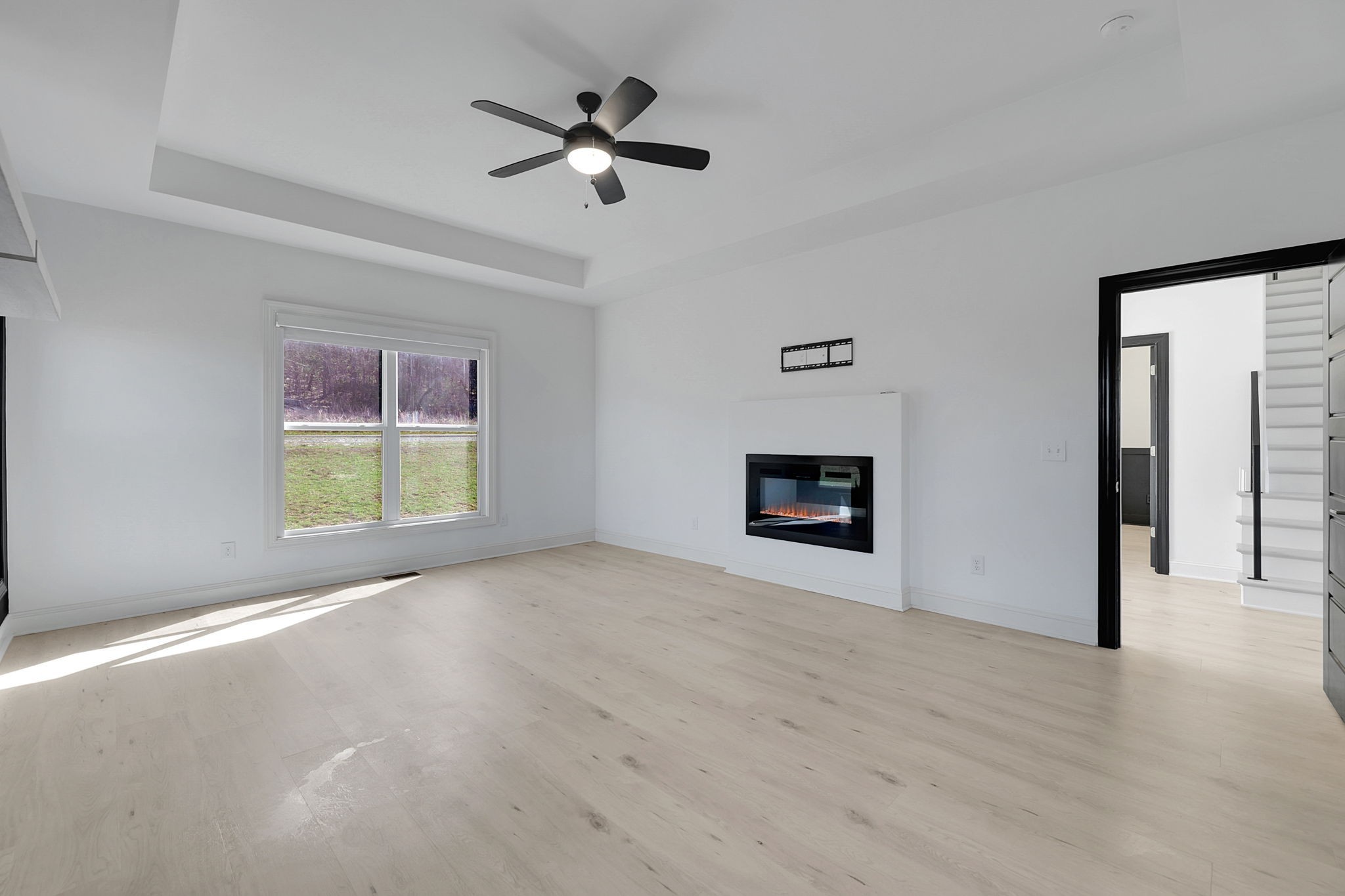 200 Charles Smith Road Lascassas, TN 37085 - Photo 31 of 62 an empty room with windows and fireplace