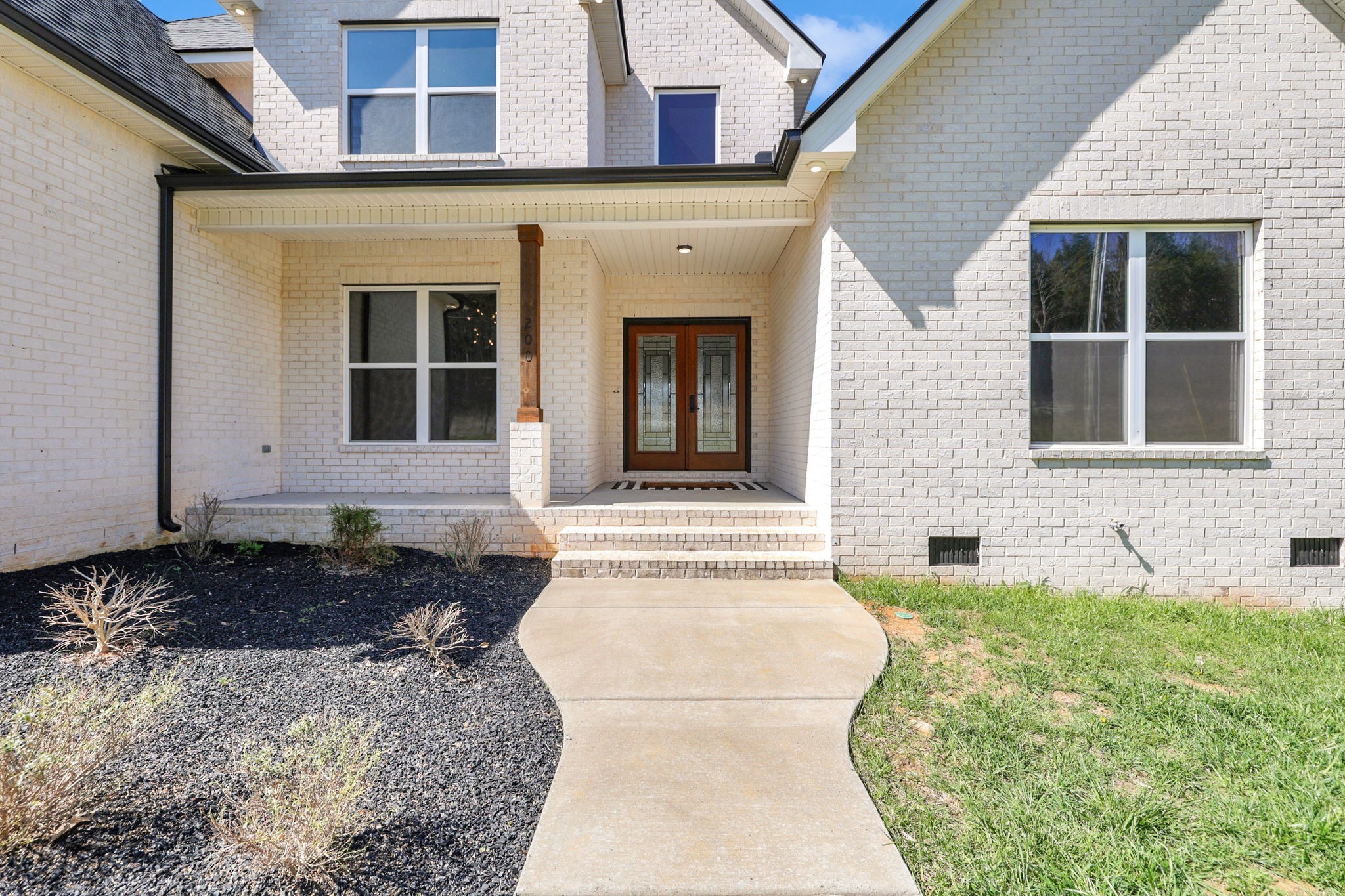200 Charles Smith Road Lascassas, TN 37085 - Photo 4 of 62 a front view of a house with a yard