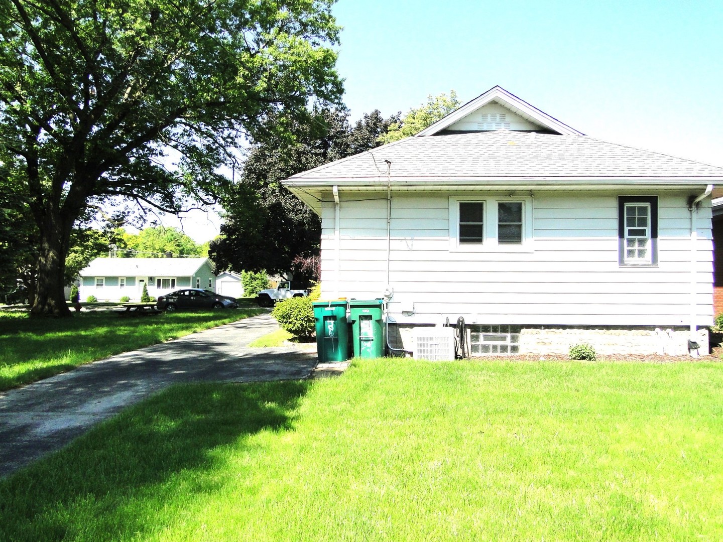 406 South Reed Street Joliet, IL 60436 - Photo 11 of 17 a front view of a house with garden
