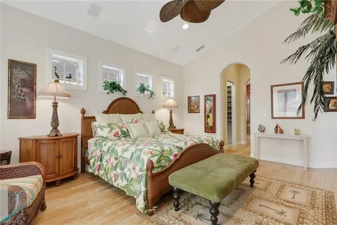 a bedroom with a bed couch and dresser