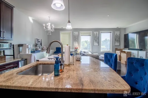 a view of a kitchen and dining room