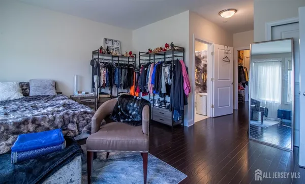 a bed room with a bed and a chair