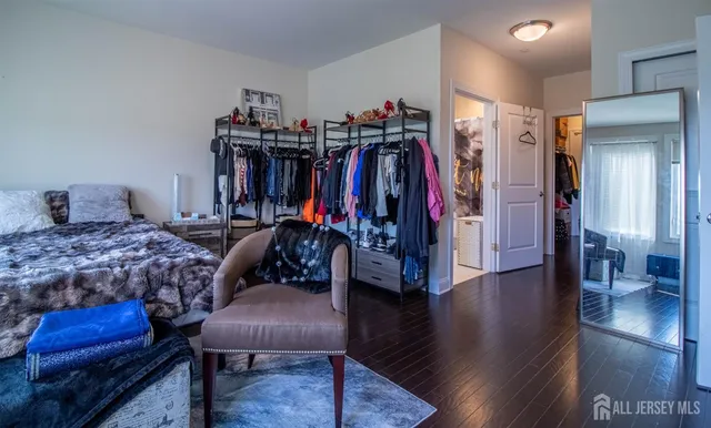 a bed room with a bed and a chair