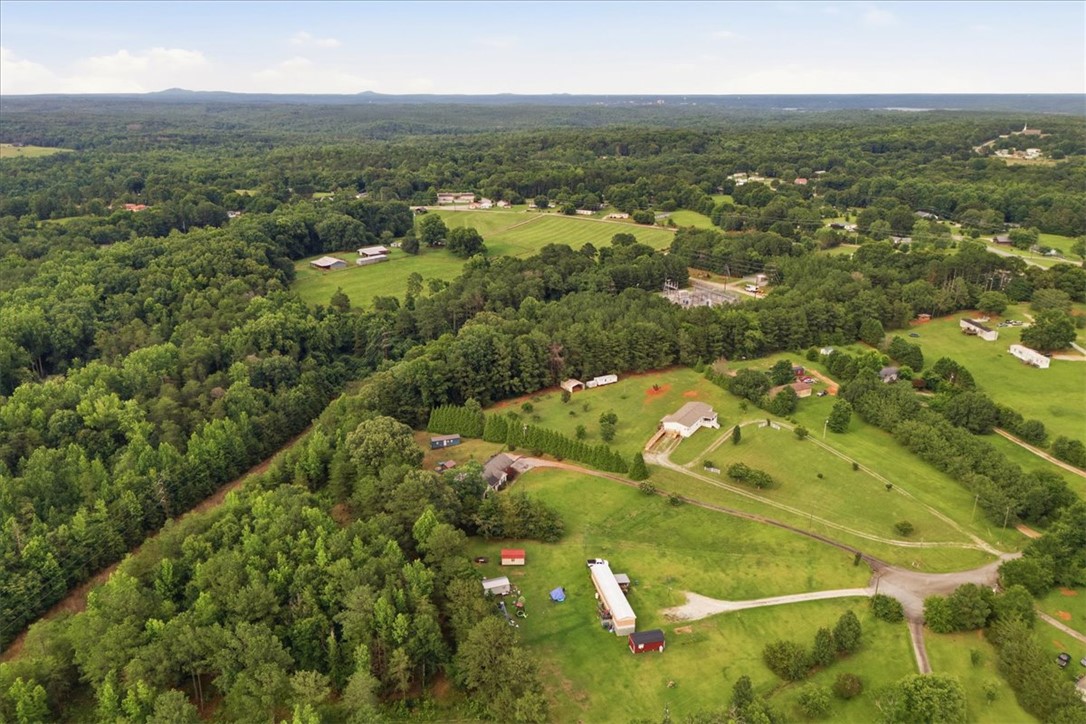 520 Sharon Lane Seneca, SC 29678 - Photo 43 of 48 Sprawling acreage presents a tranquil retreat, offering a mix of verdant woodland and open grassy expanses.