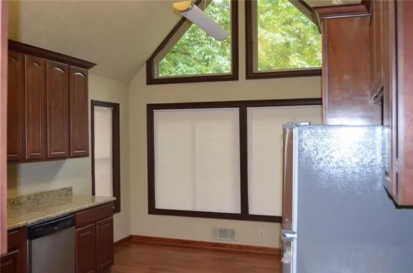 a view of an entryway with wooden floor